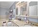 Bathroom featuring double sinks, granite counters and storage at 1390 W 78Th Cir, Denver, CO 80221