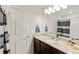 Bathroom featuring vanity with granite countertop and tub with shower at 7232 Shavano Ave, Frederick, CO 80504