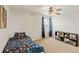 A childs bedroom featuring a ceiling fan, a window view and a toys at 7232 Shavano Ave, Frederick, CO 80504