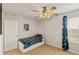 A simple bedroom featuring a ceiling fan and a window view at 7232 Shavano Ave, Frederick, CO 80504