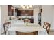 Cozy dining area featuring a table with seating and views of the kitchen at 7232 Shavano Ave, Frederick, CO 80504