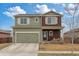 Inviting two-story home featuring a welcoming front porch with a swing and a convenient two-car garage at 7232 Shavano Ave, Frederick, CO 80504