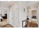 A hallway that provides access to two bedrooms and features hard wood floors at 7232 Shavano Ave, Frederick, CO 80504