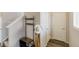 Hallway with coat rack, shoe storage bench, and a white cowboy hat hanging on the coat rack at 7232 Shavano Ave, Frederick, CO 80504