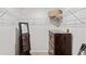 Walk-in closet with wire shelving, dresser, full-length mirror, and ample storage space at 7232 Shavano Ave, Frederick, CO 80504