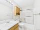 Standard bathroom with a shower-tub combination and a light wood vanity at 5010 E 100Th Dr, Thornton, CO 80229