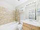 Bathroom features a bathtub, shower, and vanity with sink at 5010 E 100Th Dr, Thornton, CO 80229