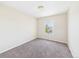 Empty carpeted bedroom with neutral walls and a single window, ready for personalization at 5010 E 100Th Dr, Thornton, CO 80229