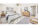 Stylishly furnished bedroom with a ceiling fan and ensuite bathroom at 5010 E 100Th Dr, Thornton, CO 80229
