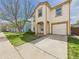 Well-kept two-story home with a tidy lawn and attached garage at 5010 E 100Th Dr, Thornton, CO 80229