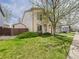 Two-story home featuring neat landscaping and a well-maintained lawn at 5010 E 100Th Dr, Thornton, CO 80229