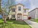Charming two-story home boasts a well-manicured lawn and inviting curb appeal at 5010 E 100Th Dr, Thornton, CO 80229