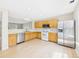 Modern kitchen features stainless steel appliances and plenty of cabinet space at 5010 E 100Th Dr, Thornton, CO 80229