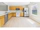 Well-lit kitchen features stainless steel appliances and ample counter space at 5010 E 100Th Dr, Thornton, CO 80229