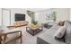 Cozy living room features a comfortable sectional and a large window at 5010 E 100Th Dr, Thornton, CO 80229