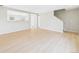 Open-concept living room featuring light wood floors and neutral tones at 5010 E 100Th Dr, Thornton, CO 80229