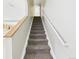 Carpeted staircase with handrails leads to the upper level at 5010 E 100Th Dr, Thornton, CO 80229