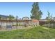 Spacious backyard featuring a garden, shed, and grassy area, ideal for outdoor activities and gardening enthusiasts at 10457 Owens Cir, Broomfield, CO 80021