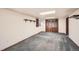 Spacious basement room with carpet flooring, storage closet, and ample lighting at 10457 Owens Cir, Broomfield, CO 80021