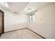 Finished basement corner with a small window for light and neutral color carpets at 10457 Owens Cir, Broomfield, CO 80021
