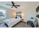 Cozy bedroom featuring neutral walls, a ceiling fan, and comfortable chair and bedding at 10457 Owens Cir, Broomfield, CO 80021