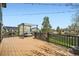 Beautiful wooden deck with dark railings and outdoor seating, perfect for enjoying the backyard views and outdoor relaxation at 10457 Owens Cir, Broomfield, CO 80021