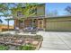 Inviting front patio area with comfortable seating, a well-manicured garden, and a cozy atmosphere at 10457 Owens Cir, Broomfield, CO 80021