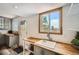 Additional kitchen counter space with sink, windows, backyard access, and storage for all your kitchen needs at 10457 Owens Cir, Broomfield, CO 80021