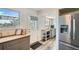 Bright kitchen with stainless steel refrigerator, wooden counter, convenient access to backyard, and modern cabinets at 10457 Owens Cir, Broomfield, CO 80021