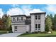 Modern two-story home featuring stone accents, gray siding, a two-car garage, and a well-manicured front lawn at 8272 Snake River St, Littleton, CO 80125