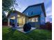 Spacious backyard with a covered patio, perfect for outdoor entertaining and relaxation, featuring a grill at 8464 E 55Th Pl, Denver, CO 80238