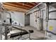Unfinished basement with gym equipment at 8464 E 55Th Pl, Denver, CO 80238