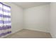 Simple bedroom with neutral carpet and one window, perfect for a guest room or room at 8464 E 55Th Pl, Denver, CO 80238