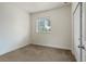 Neutral bedroom featuring a large window and a standard-size closet at 8464 E 55Th Pl, Denver, CO 80238
