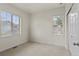 Bright bedroom with two windows offering natural light and a closet for ample storage at 8464 E 55Th Pl, Denver, CO 80238