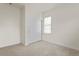 Carpeted bedroom with white walls and a closet with mirrored sliding doors at 8464 E 55Th Pl, Denver, CO 80238