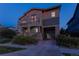 Charming two-story home with a stone-accented porch and balcony, plus a covered garage entrance at 8464 E 55Th Pl, Denver, CO 80238