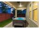 Relaxing backyard hot tub under covered patio, offering a private and serene escape at 8464 E 55Th Pl, Denver, CO 80238