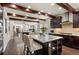 Gourmet kitchen with dark cabinets, a center island, granite counters and stainless steel appliances at 8464 E 55Th Pl, Denver, CO 80238