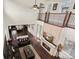 Spacious living room with a fireplace and large windows, featuring hardwood floors and plenty of natural light at 8464 E 55Th Pl, Denver, CO 80238