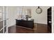 Office with a large dark wood desk, hardwood floors, and two windows with blinds at 8464 E 55Th Pl, Denver, CO 80238