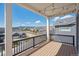 Inviting deck with string lights, offering ample space and beautiful neighborhood views at 6586 S Lewis Ct, Littleton, CO 80127