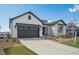 Charming home exterior with a well-maintained lawn and inviting curb appeal at 6586 S Lewis Ct, Littleton, CO 80127