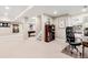 Spacious finished basement with pool table, office space, and home gym equipment at 9556 Kemper Dr, Lone Tree, CO 80124