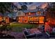 Inviting backyard with a brick patio, lush lawn, and cozy seating, perfect for outdoor relaxation at 239 Ash St, Denver, CO 80220