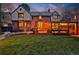 Beautiful backyard with brick patio, pergola with string lights, sport court, and lush landscaping at 239 Ash St, Denver, CO 80220