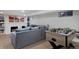 Finished basement with a cozy seating area, foosball table, and a decorative fireplace at 239 Ash St, Denver, CO 80220