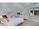 Charming bedroom features soft pastel colors and whimsical decorative accents at 239 Ash St, Denver, CO 80220