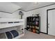 bedroom with bunk beds, complemented by storage shelving and a large window at 239 Ash St, Denver, CO 80220