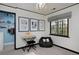 Cozy bedroom with a decorative wall decor, gray window treatments and a comfortable beanbag chair at 239 Ash St, Denver, CO 80220
